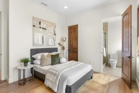 a bedroom with a bed and a view of bathroom