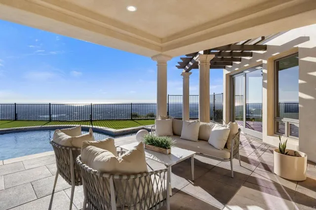 a patio with water fountain and a table