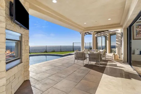 a lobby with furniture and floor to ceiling window