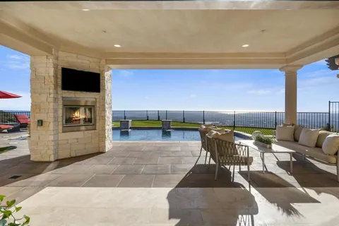 a view of a patio with a table and chairs