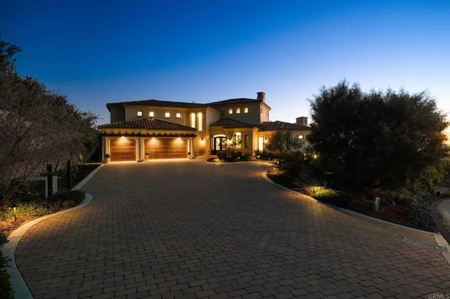 an aerial view of residential building and trees around
