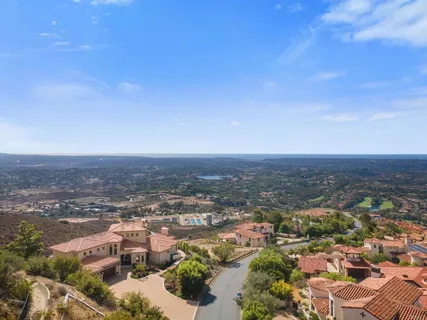 a view of a large building with a yard