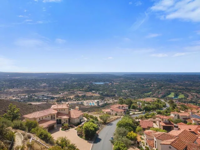 a view of a large building with a yard
