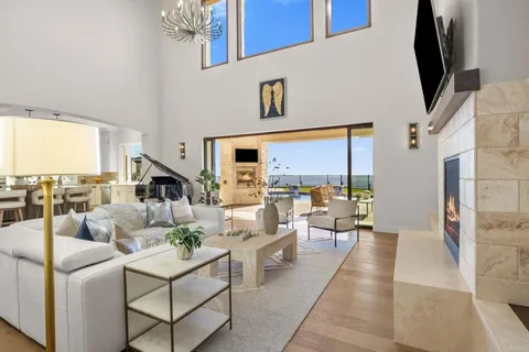 a living room with fireplace furniture and a flat screen tv