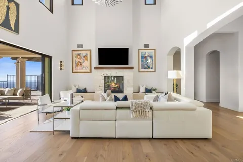 a living room with fireplace furniture and a flat screen tv
