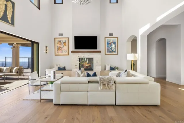 a living room with fireplace furniture and a flat screen tv