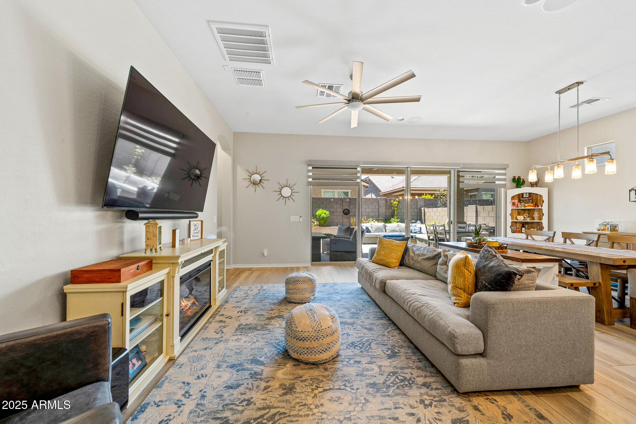 4155 East Jesse Street Gilbert, AZ 85295 - Photo 14 of 71 a living room with fireplace furniture and a flat screen tv