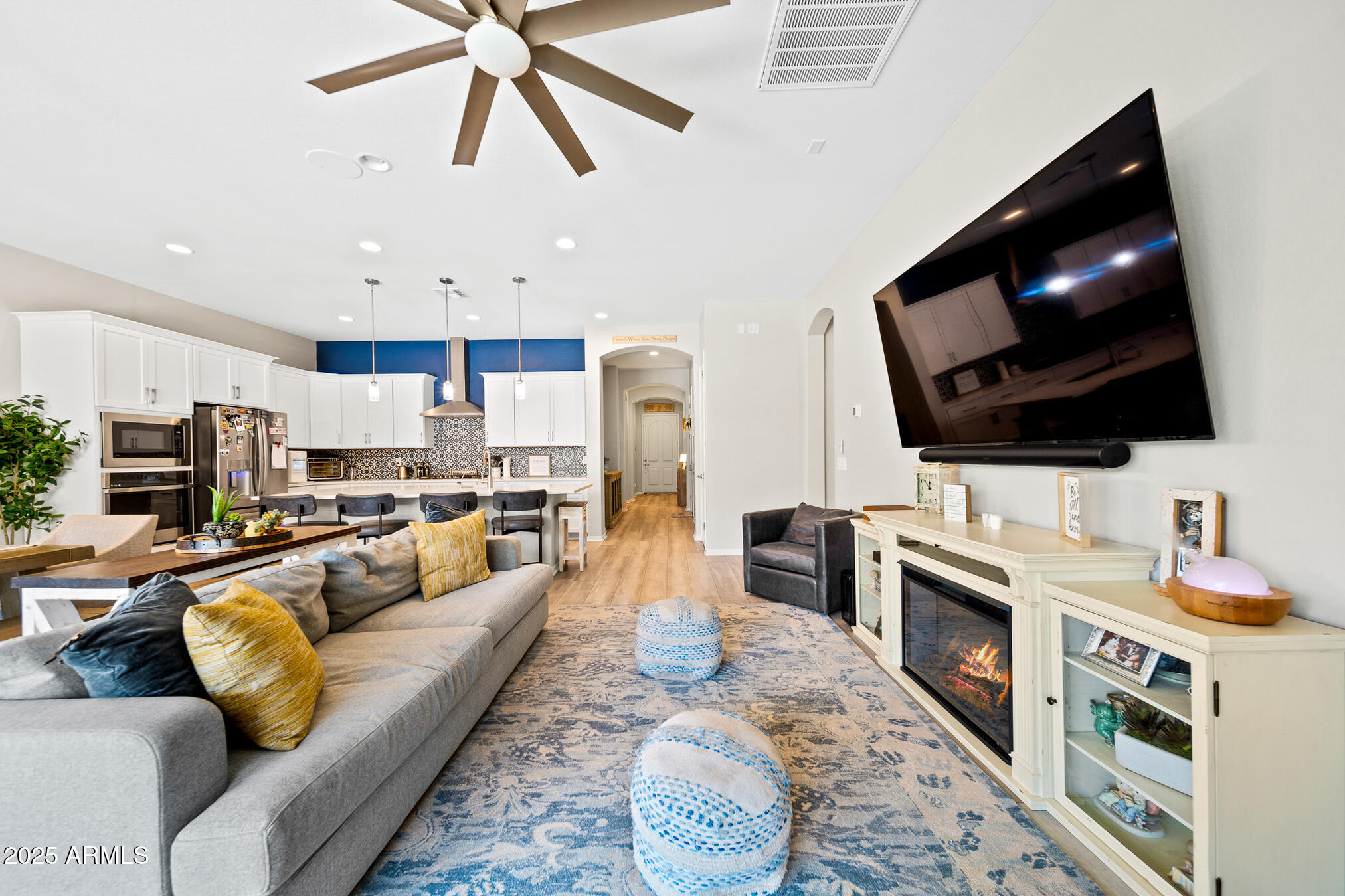 4155 East Jesse Street Gilbert, AZ 85295 - Photo 16 of 71 a living room with furniture and a flat screen tv