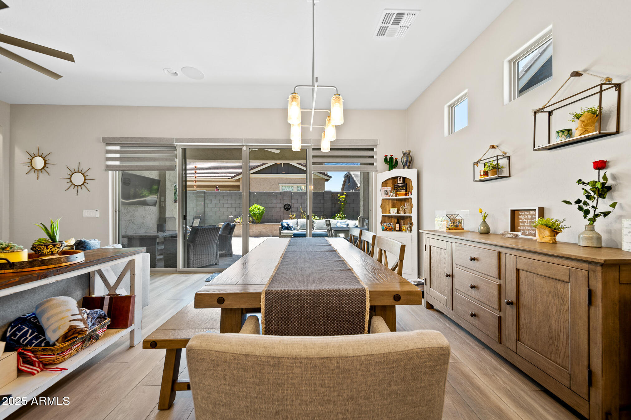 4155 East Jesse Street Gilbert, AZ 85295 - Photo 17 of 71 a living room with furniture and a chandelier