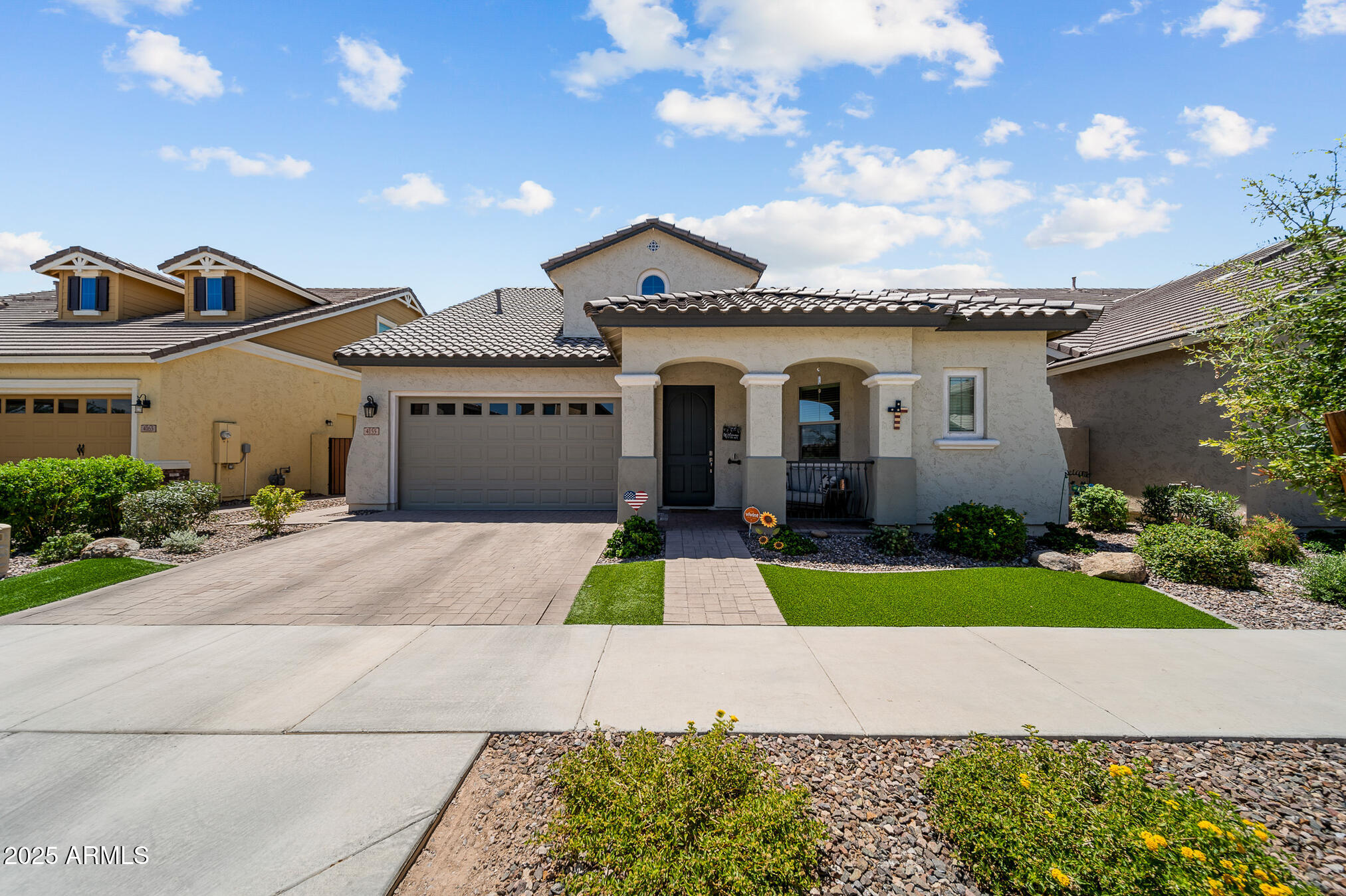 4155 East Jesse Street Gilbert, AZ 85295 - Photo 2 of 71 a front view of a house with a yard and garage