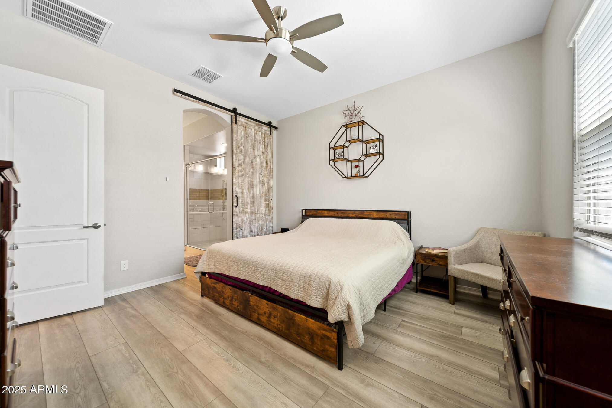 4155 East Jesse Street Gilbert, AZ 85295 - Photo 25 of 71 a bedroom with a bed and a table