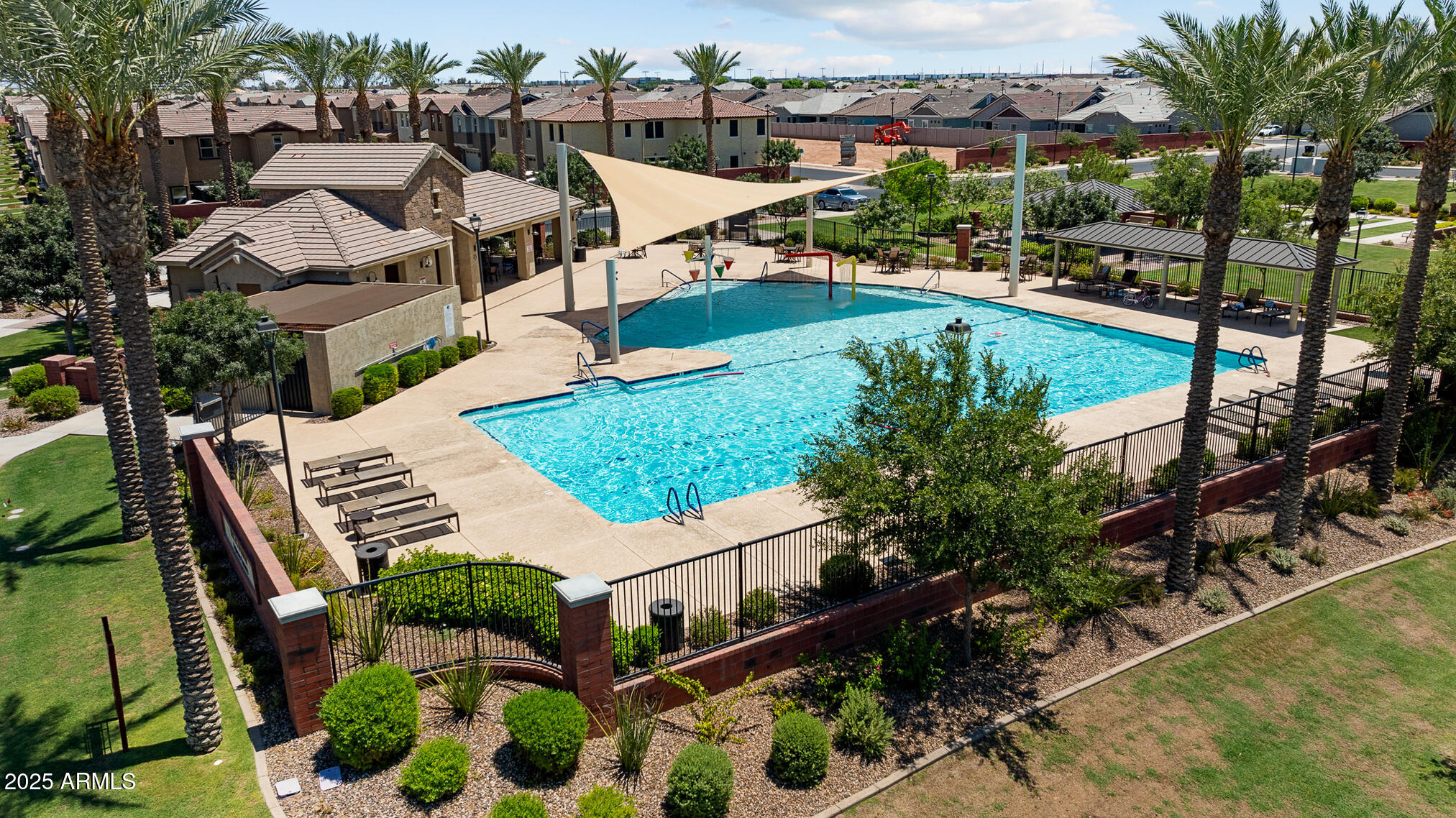 4155 East Jesse Street Gilbert, AZ 85295 - Photo 3 of 71 a view of a swimming pool with a patio and garden