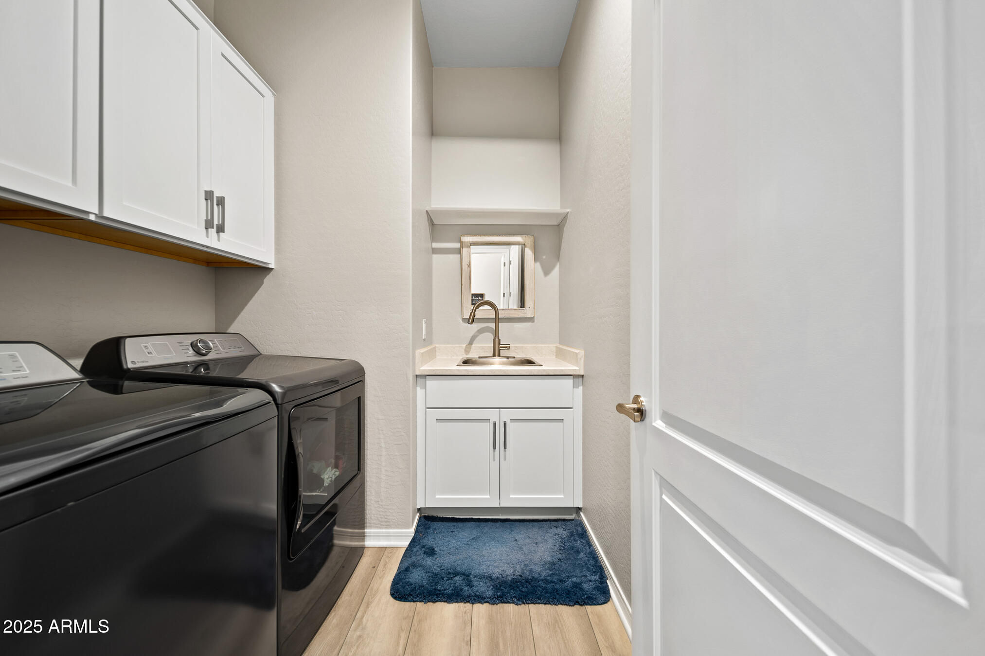 4155 East Jesse Street Gilbert, AZ 85295 - Photo 33 of 71 a kitchen with a sink a stove and cabinets