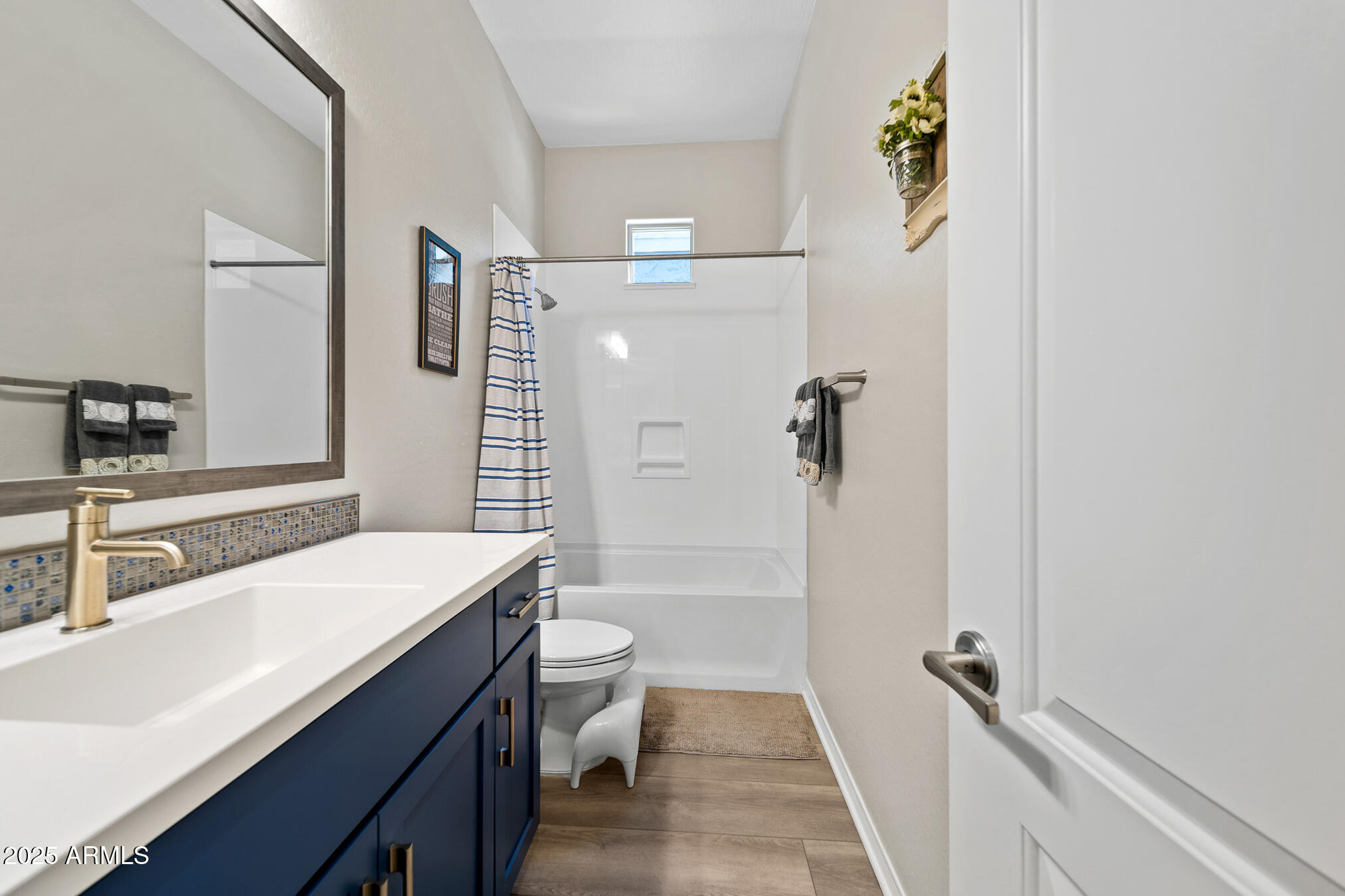 4155 East Jesse Street Gilbert, AZ 85295 - Photo 41 of 71 a bathroom with a sink a toilet and shower