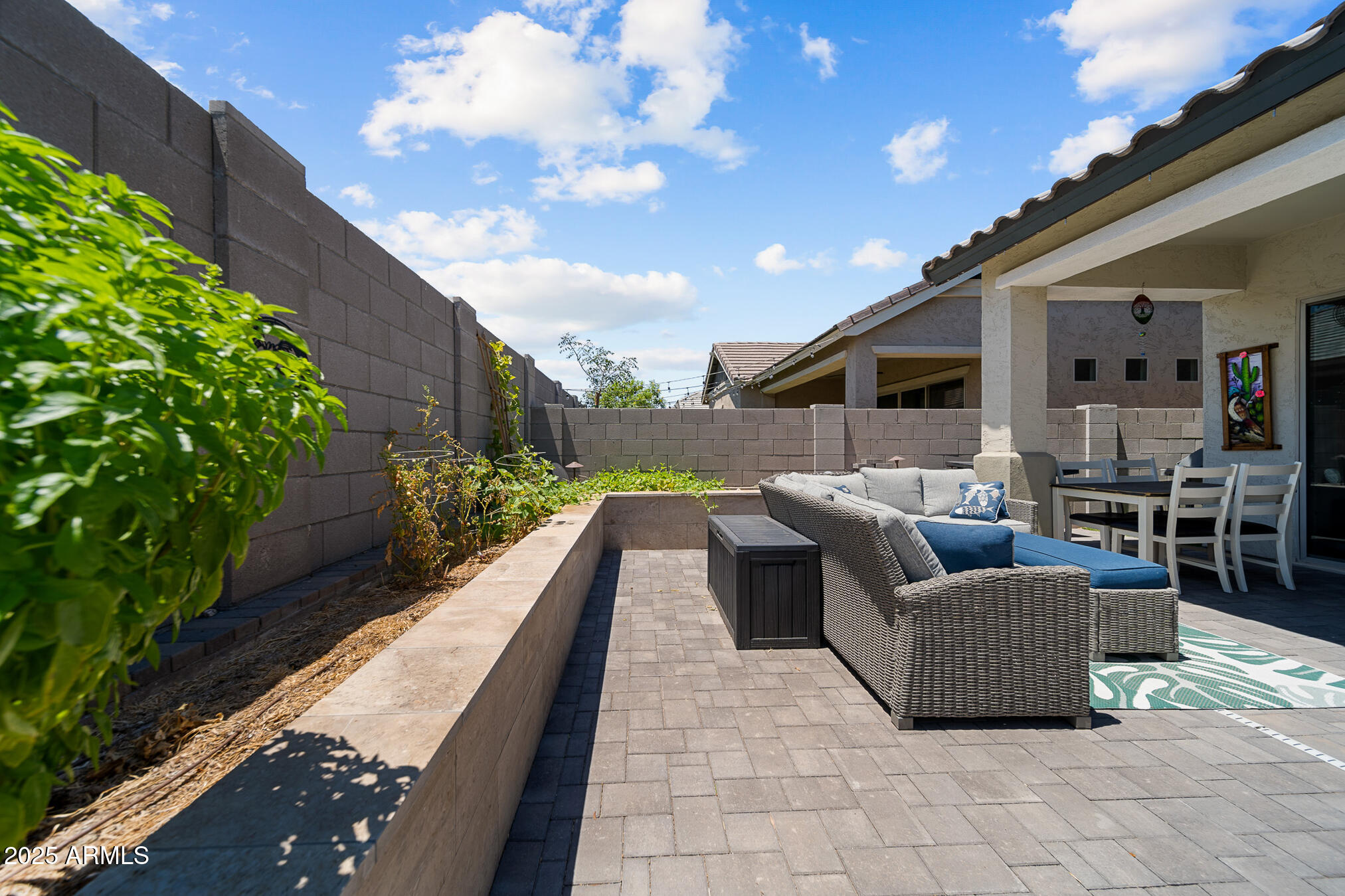 4155 East Jesse Street Gilbert, AZ 85295 - Photo 45 of 71 a balcony with furniture and a potted plant