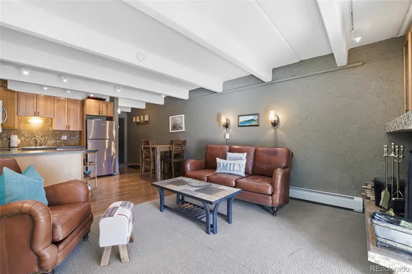 a living room with furniture and a table