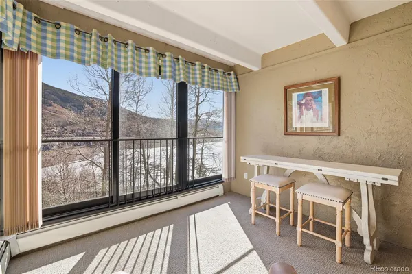 a view of a large window with wooden floor