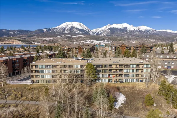 a view of building with mountains in the background