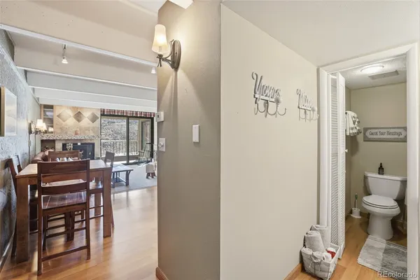 a living room with furniture and a toilet