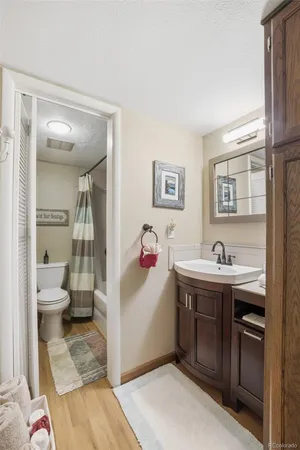 a view of bathroom with a sink and mirror
