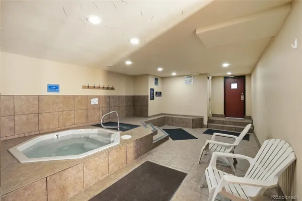 a kitchen with a sink and a stove top oven