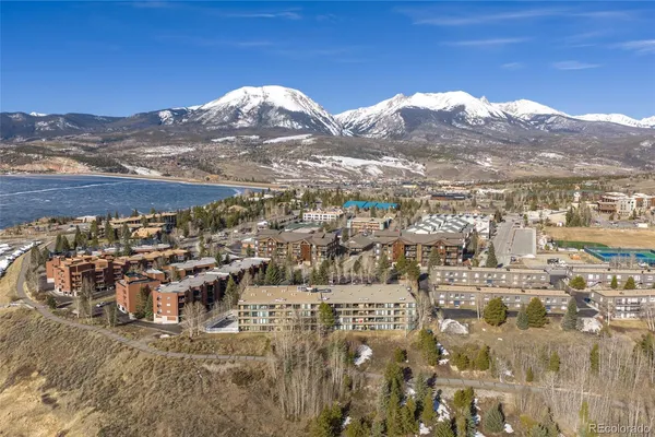 a view of a town with mountains in the background