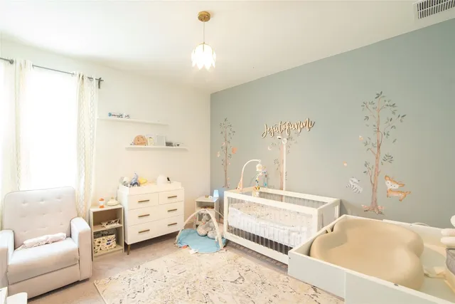 a bedroom with furniture and a couch