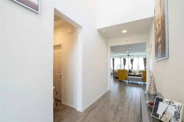 a view of living room with furniture and wooden floor