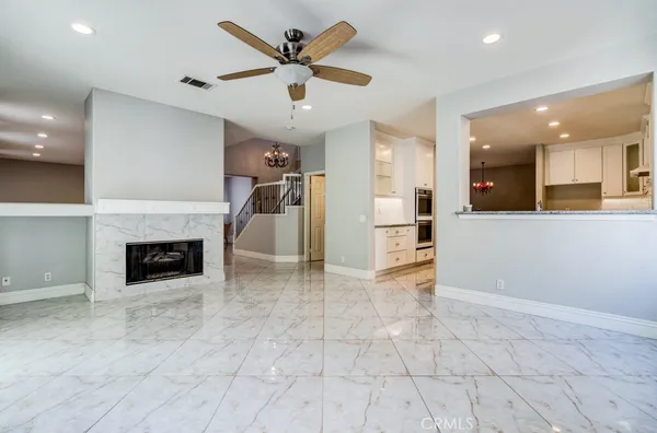 a kitchen with granite countertop cabinets and stainless steel appliances