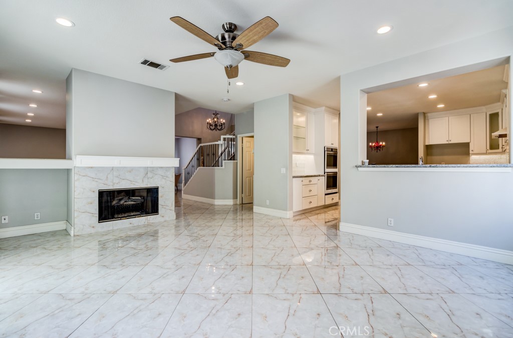 8 Zinnia Irvine, CA 92618 - Photo 14 of 63 an empty room with windows and a fireplace