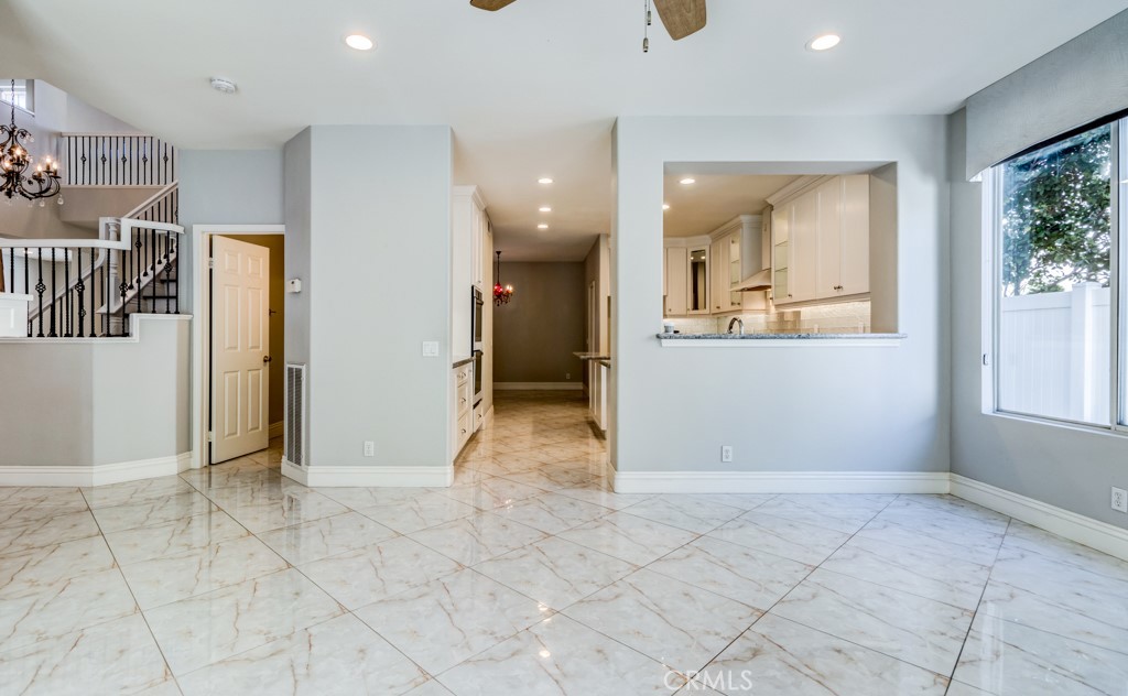 8 Zinnia Irvine, CA 92618 - Photo 17 of 63 a view of a big room with entryway and wooden floor