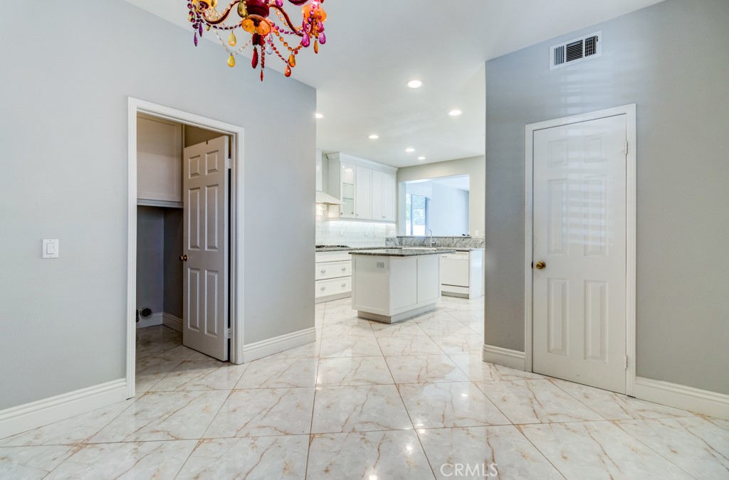 8 Zinnia Irvine, CA 92618 - Photo 18 of 63 a view of a kitchen with a sink and a refrigerator