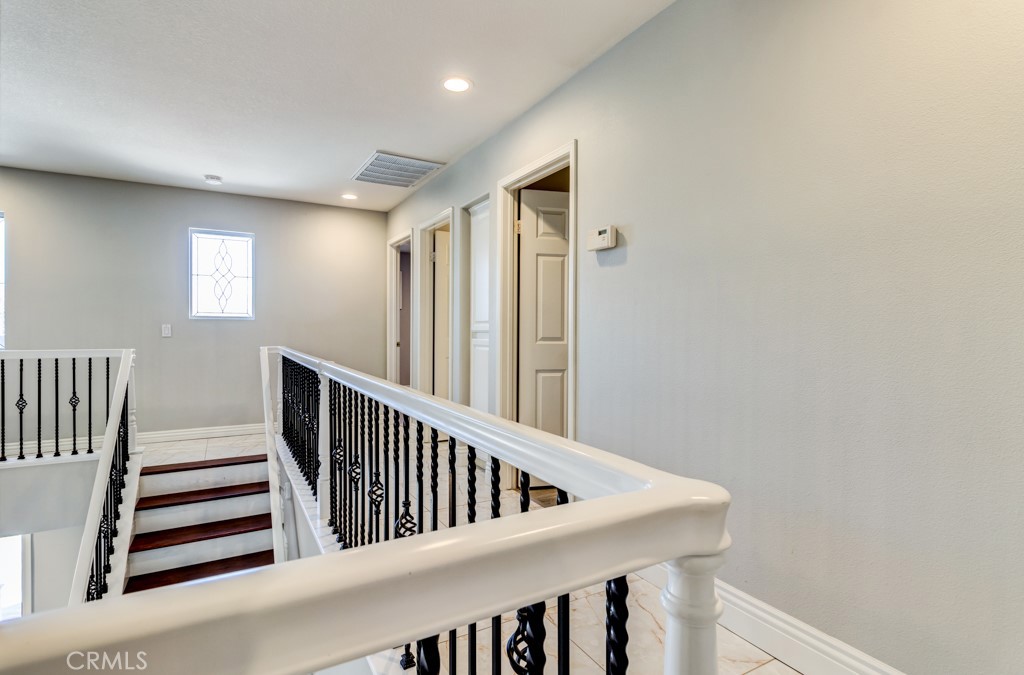 8 Zinnia Irvine, CA 92618 - Photo 31 of 63 a view of a hallway with stairs