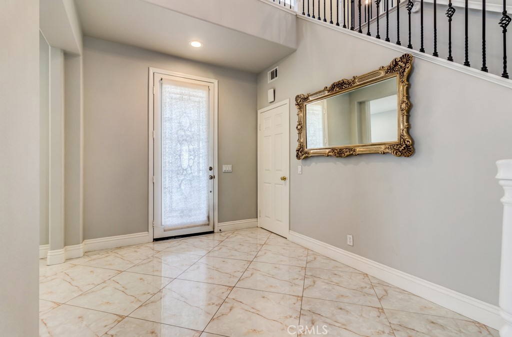 8 Zinnia Irvine, CA 92618 - Photo 4 of 63 a view of a door with wooden floor