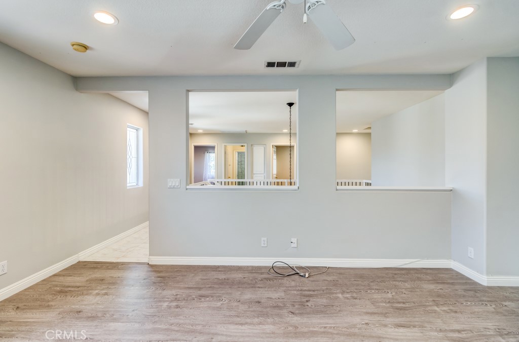 8 Zinnia Irvine, CA 92618 - Photo 47 of 63 a view of an empty room with wooden floor and a window