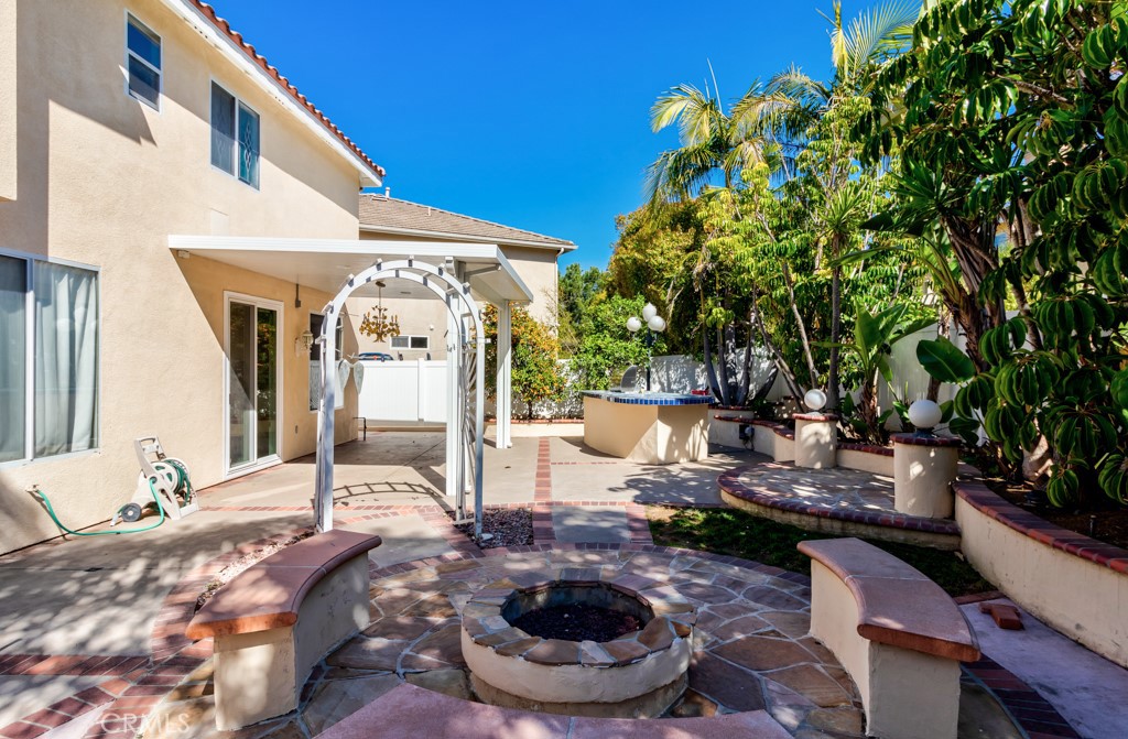 8 Zinnia Irvine, CA 92618 - Photo 52 of 63 a view of a porch with furniture and a fire pit
