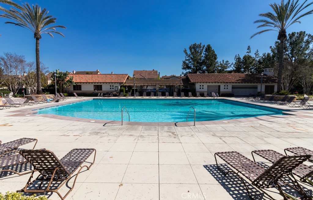 8 Zinnia Irvine, CA 92618 - Photo 61 of 63 a view of a backyard with couches under an umbrella