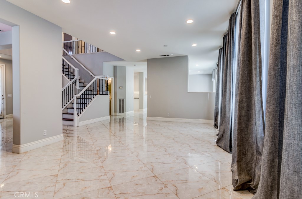 8 Zinnia Irvine, CA 92618 - Photo 10 of 63 a view of entryway with stairs and front door