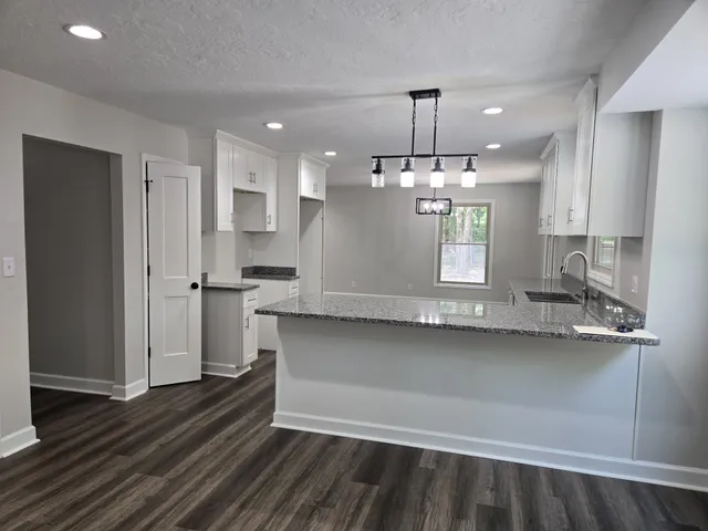 a bathroom with sink and mirror