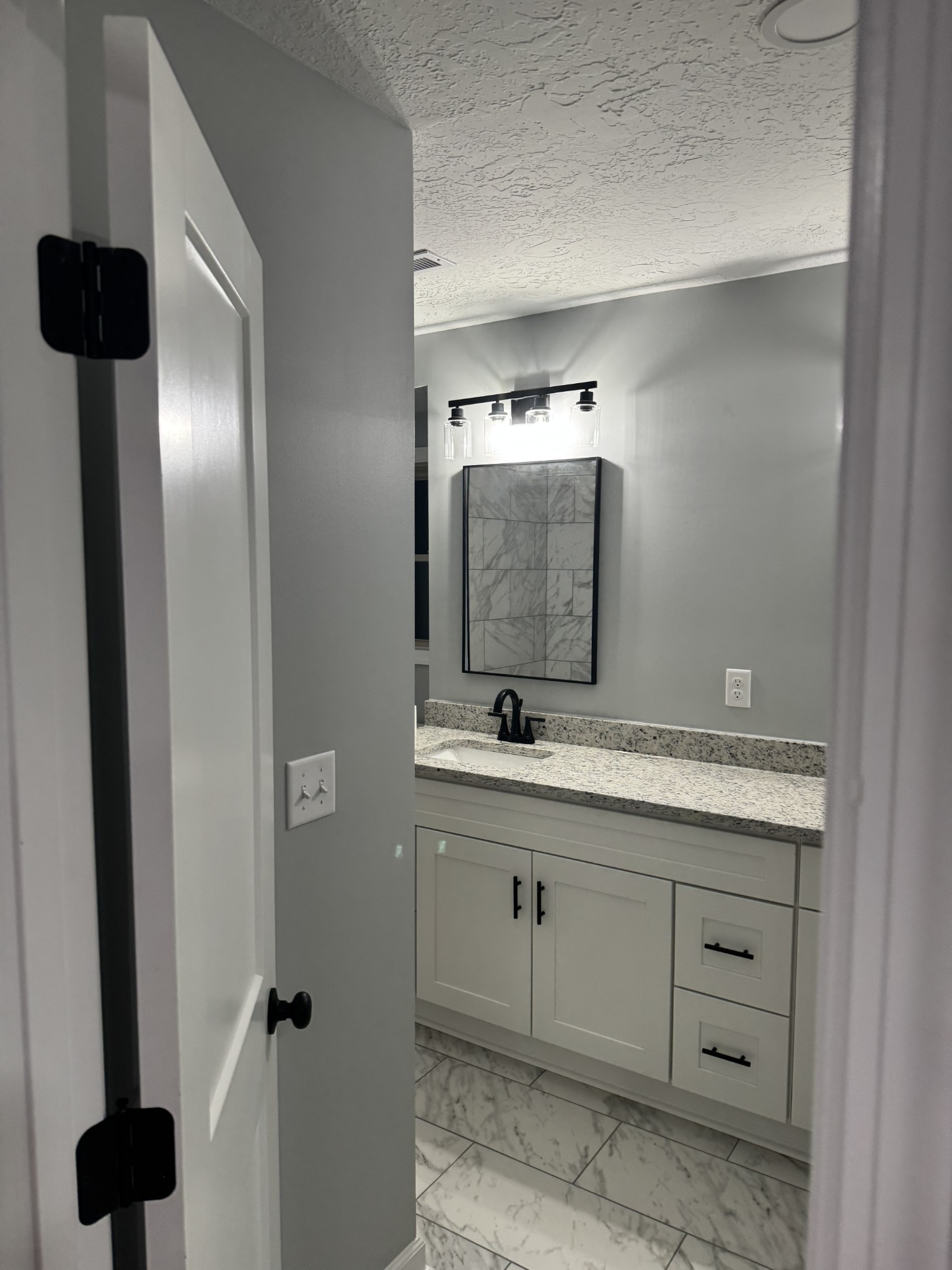 7 Bush Court Waverly, TN 37185 - Photo 35 of 48 a bathroom with a double vanity sink and mirror
