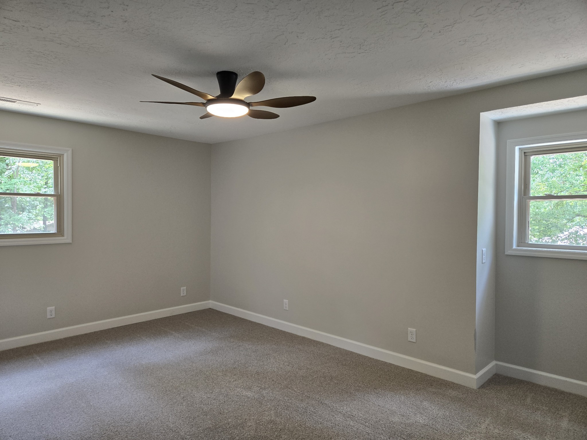 7 Bush Court Waverly, TN 37185 - Photo 41 of 48 an empty room with a window and ceiling fan