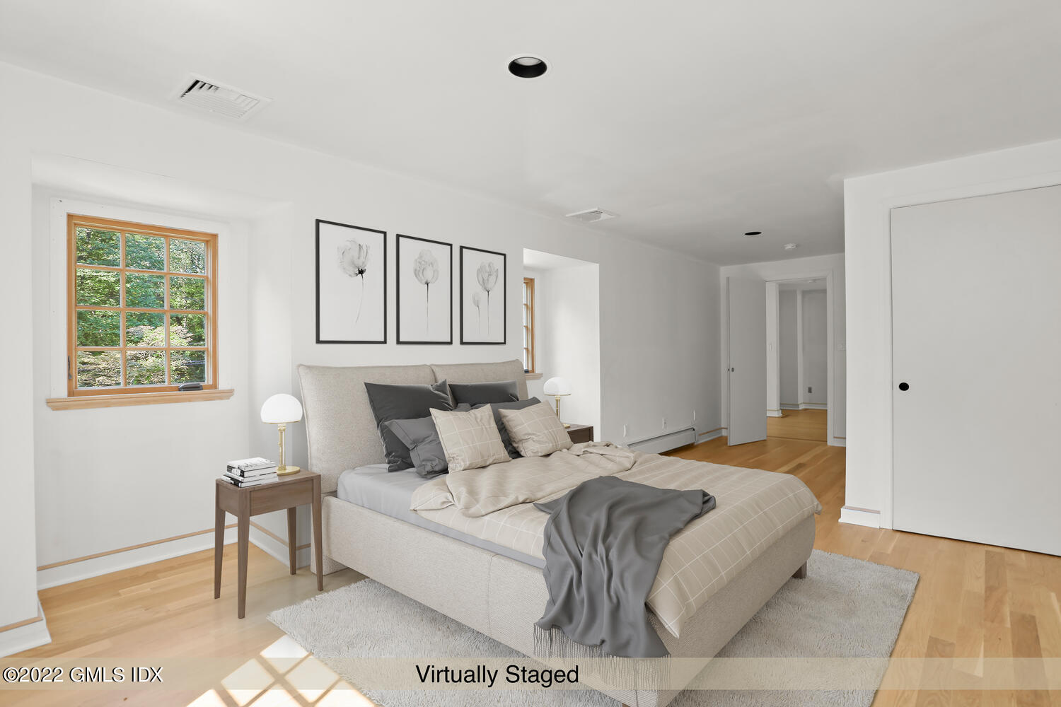 229 Cognewaugh Road Cos Cob, CT 06807 - Photo 14 of 24 a bedroom with a large bed and a window