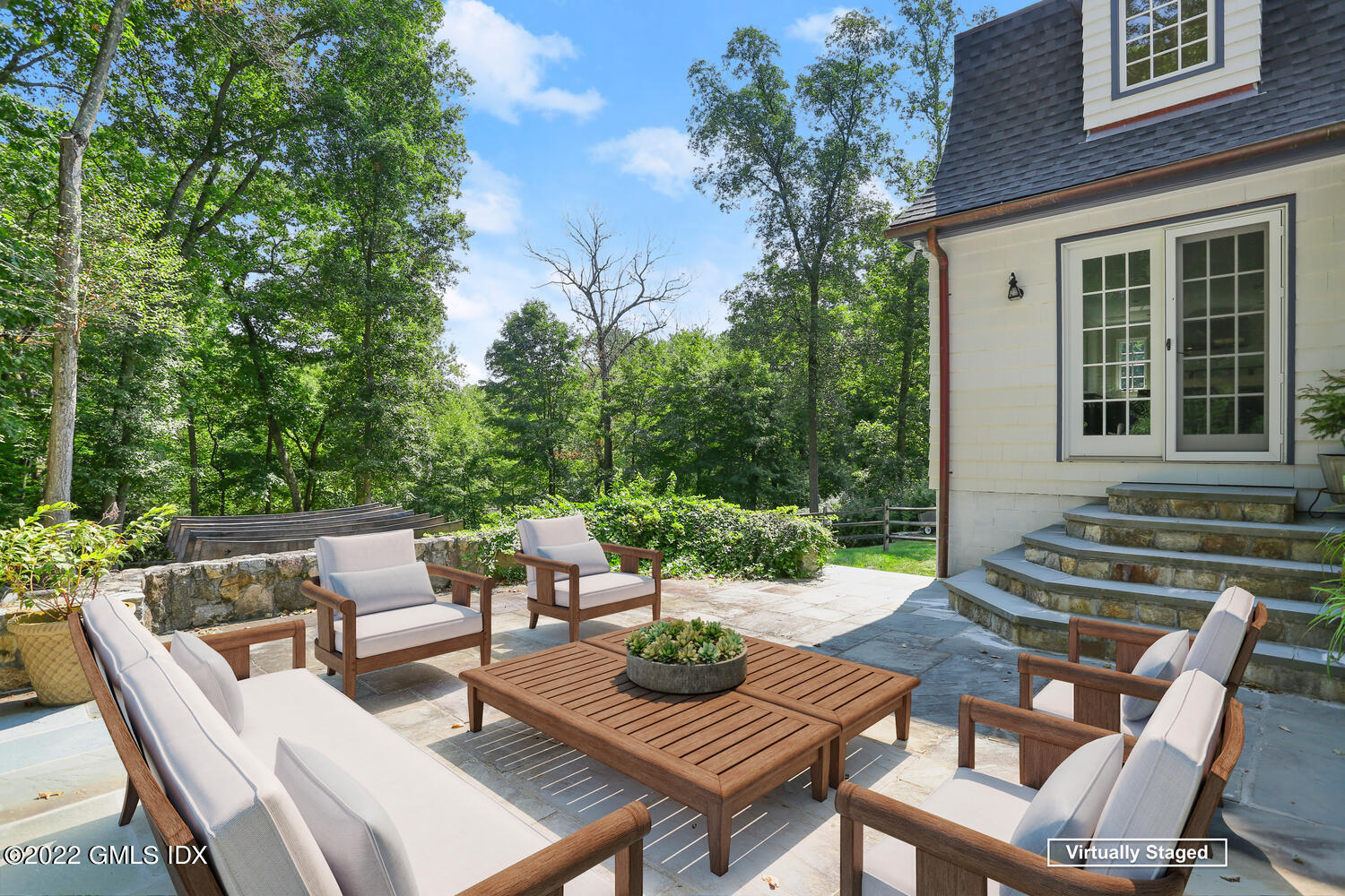 229 Cognewaugh Road Cos Cob, CT 06807 - Photo 18 of 24 a view of a patio with table and chairs and potted plants