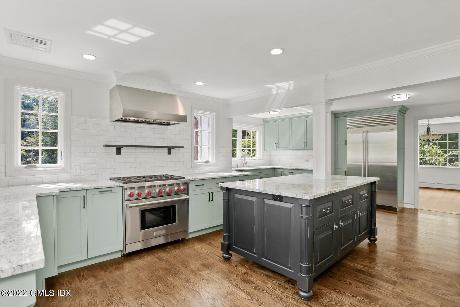 229 Cognewaugh Road Cos Cob, CT 06807 - Photo 4 of 24 a kitchen with stainless steel appliances granite countertop a stove and a sink