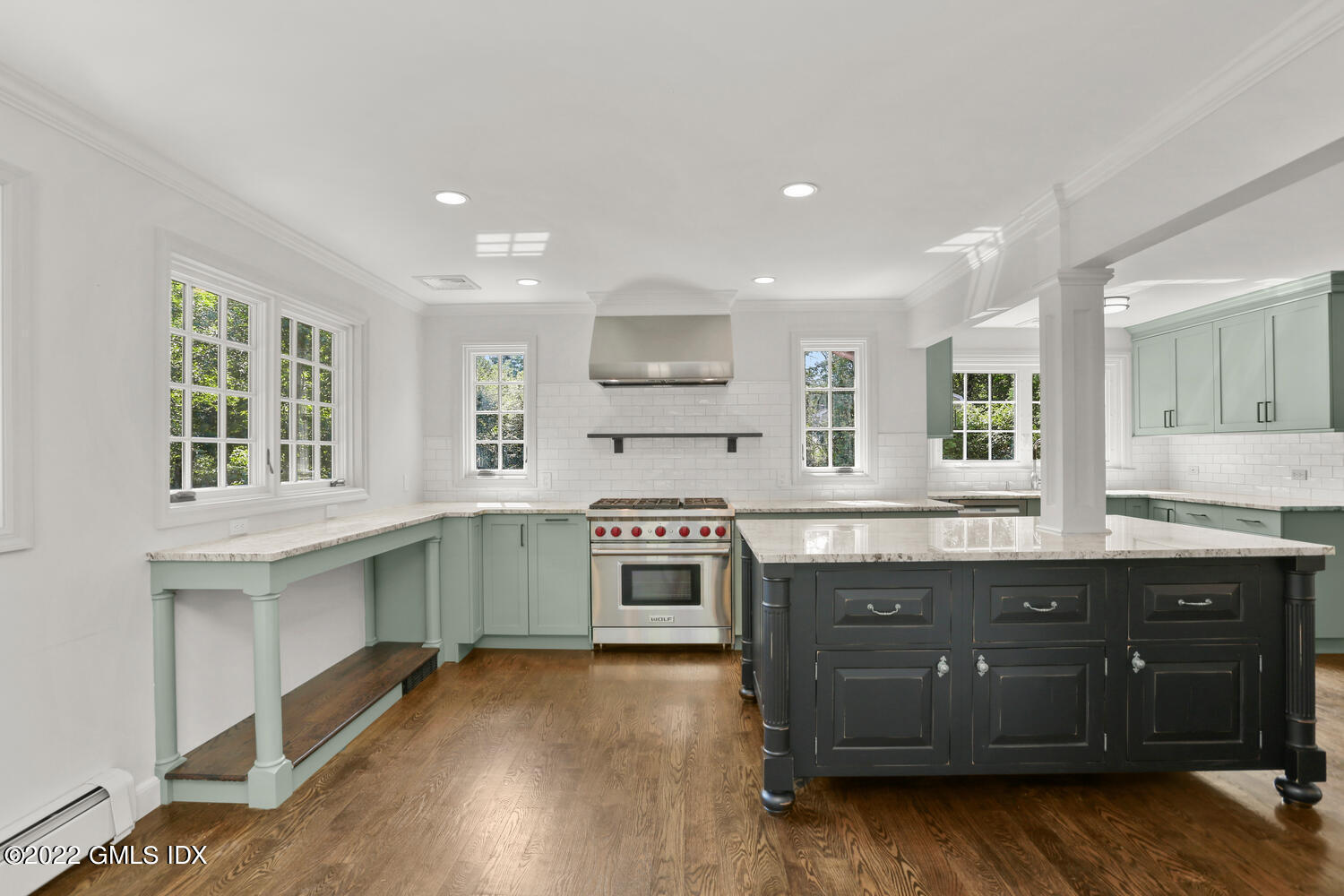 229 Cognewaugh Road Cos Cob, CT 06807 - Photo 5 of 24 a kitchen with stainless steel appliances granite countertop a stove and a sink