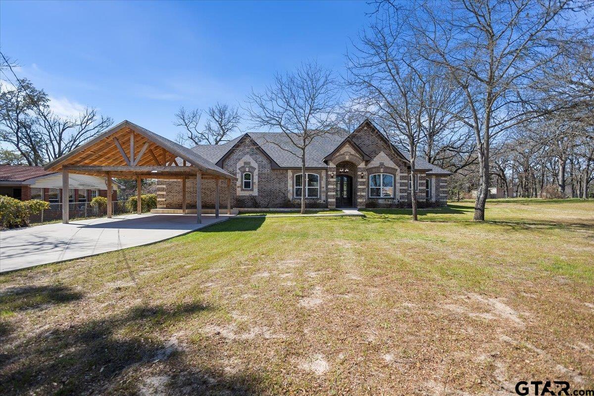 a front view of a house with a yard