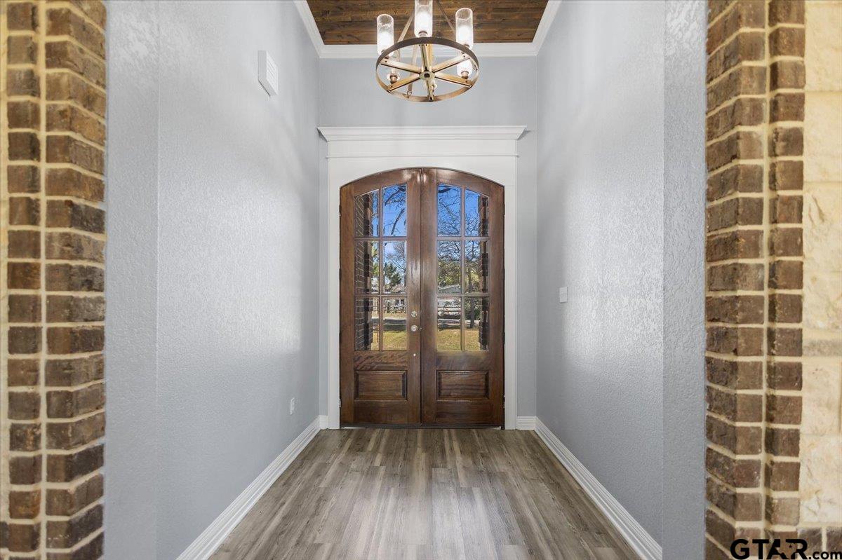 9629 Matise Street Tyler, TX 75706 - Photo 15 of 48 a view of a livingroom with wooden floor and a window