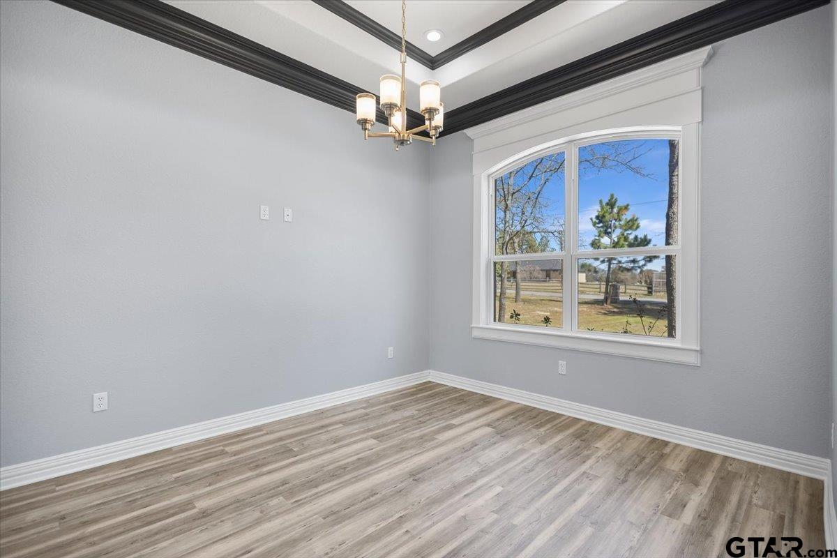 9629 Matise Street Tyler, TX 75706 - Photo 17 of 48 a view of a livingroom with a window and a ceiling fan