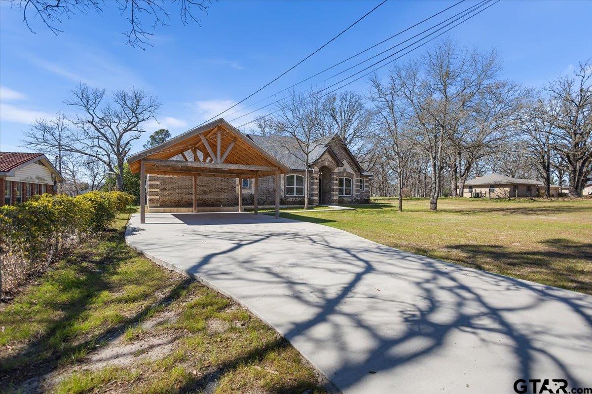 9629 Matise Street Tyler, TX 75706 - Photo 2 of 48 a house with swimming pool in front of it