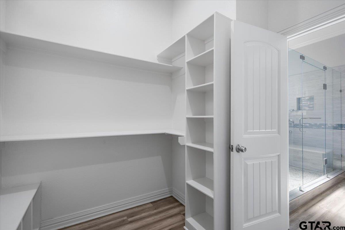 9629 Matise Street Tyler, TX 75706 - Photo 30 of 48 a view of walk in closet with empty racks